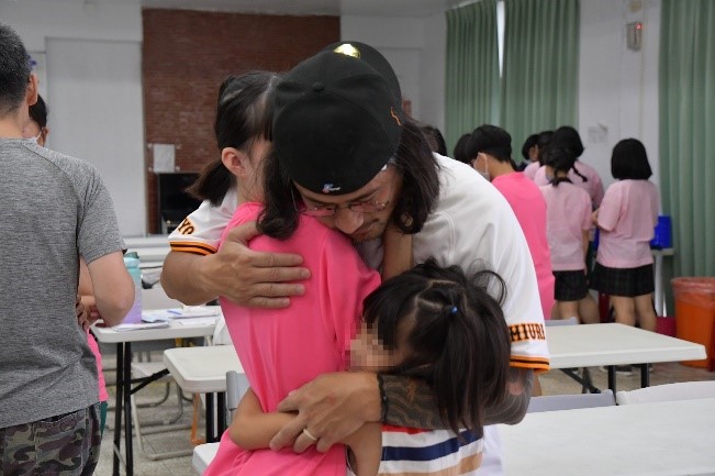 Warm hug from father after long absence