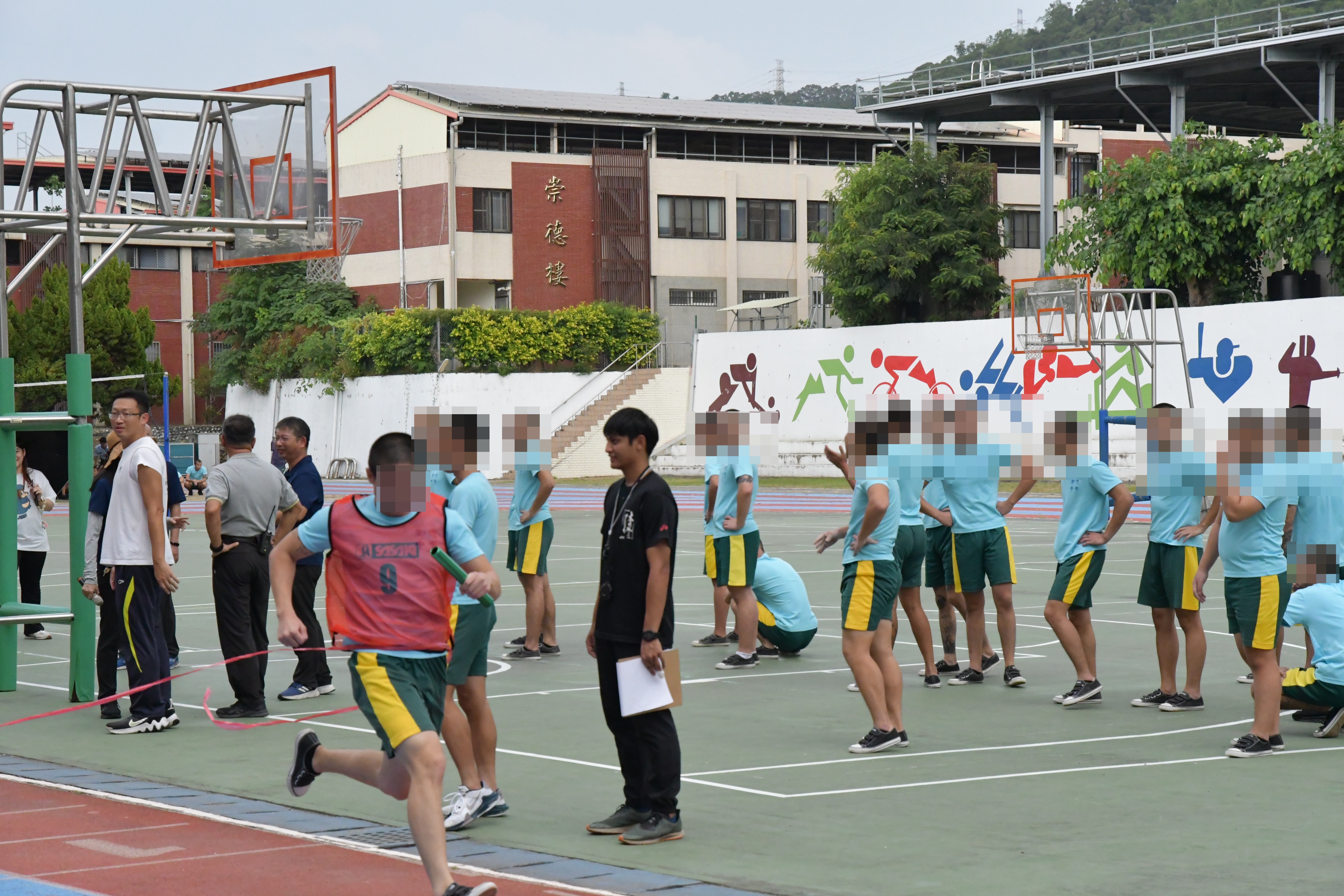Upon reaching the finish line, the teachers and students of the school burst into cheers