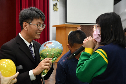 Principal Chen distributes balloons - the scene is filled with a warm atmosphere